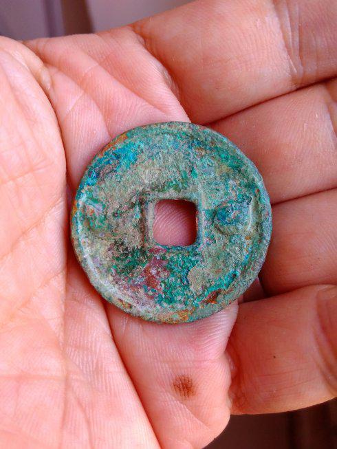 金卫绍王遗珍-崇庆元宝背星月